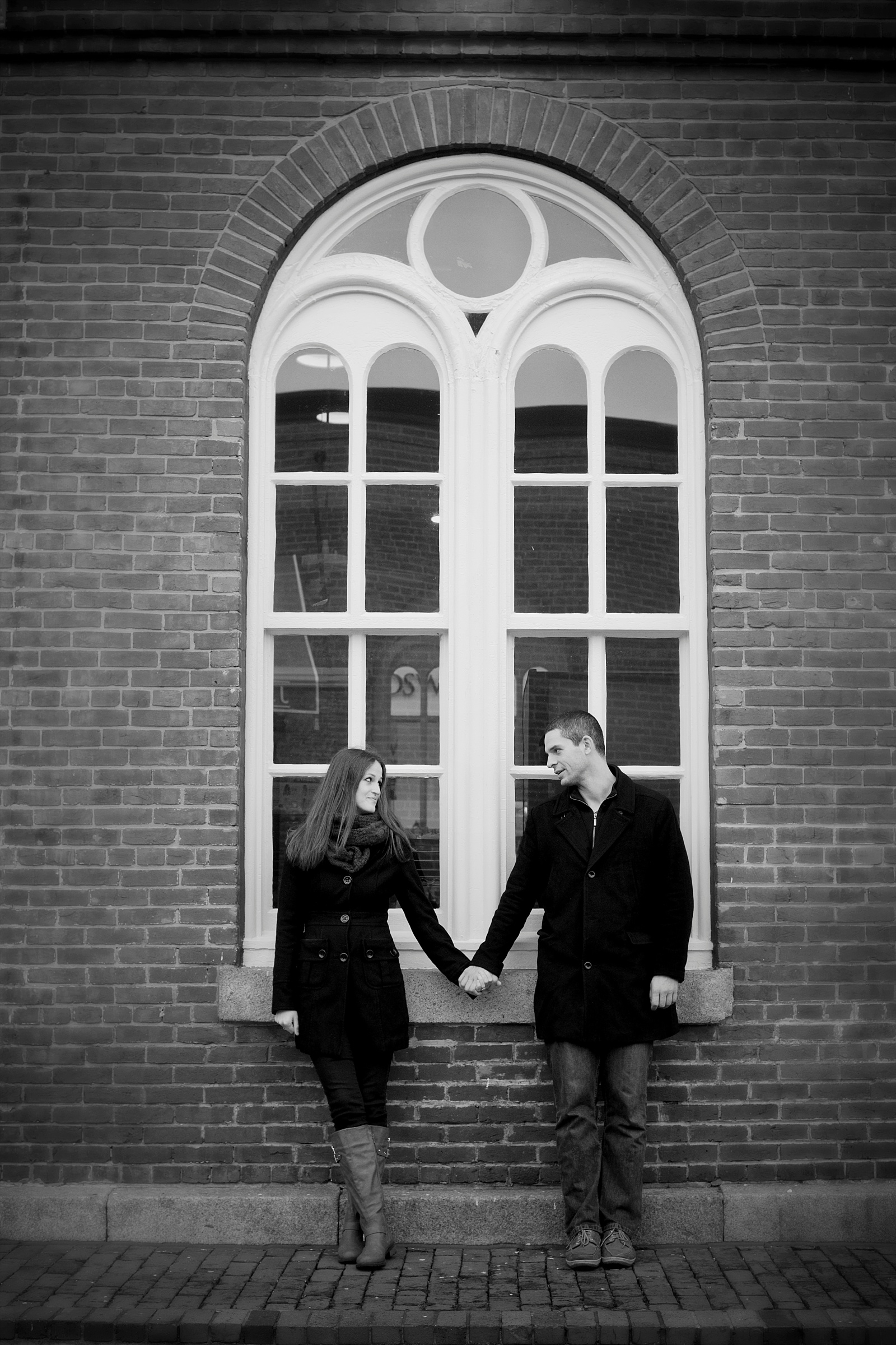 Engagement Photos in front the windows of Dean and Deluca's in Georgetown, DC