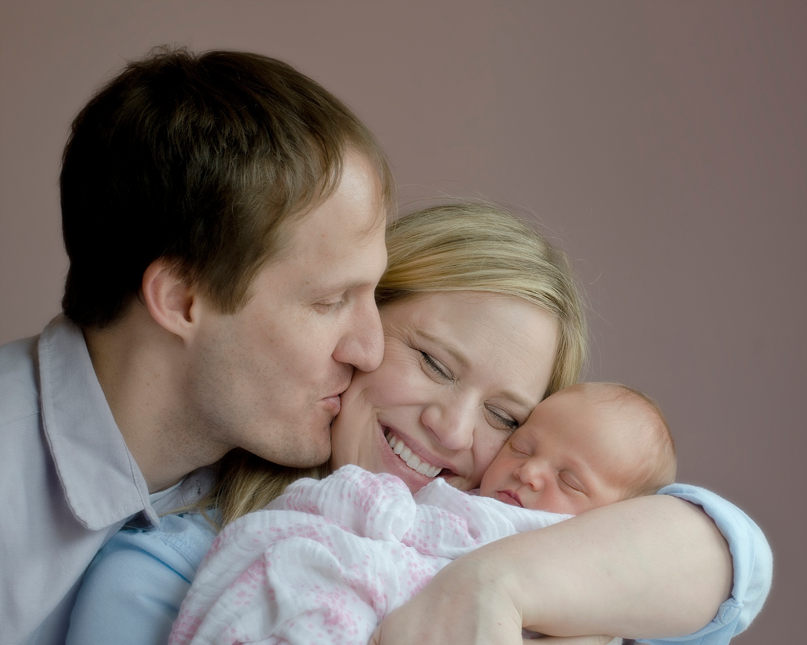 Newborn Girl with parents Lifestyle Photography Session in Pink Nursery