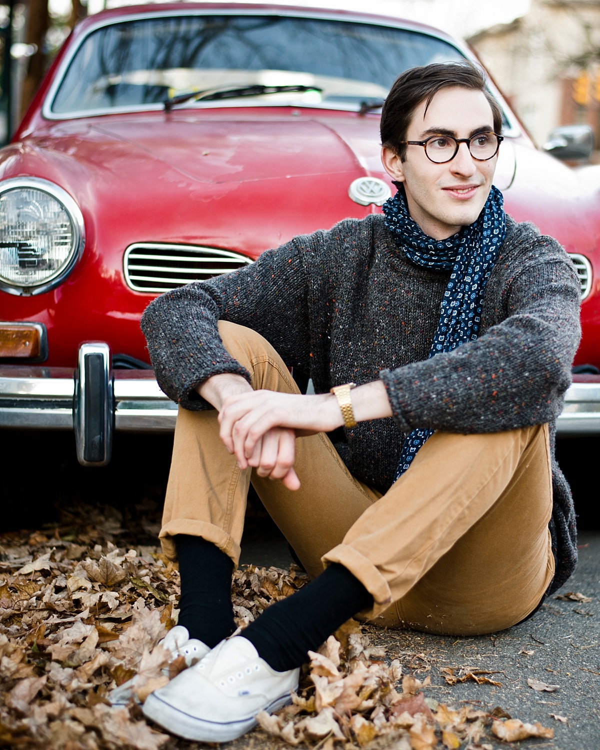 Creative headshots with red car in old town alexandria